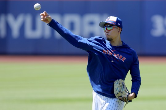 Jun 1, 2024; New York City, New York, USA; New York Mets injured starting pitcher Kodai Senga (34) throws a baseball in the outfield before a game against the Arizona Diamondbacks at Citi Field. Mandatory Credit: Brad Penner-USA TODAY Sports