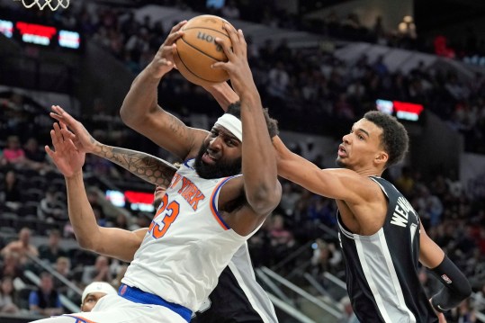 New York Knicks center Mitchell Robinson (23) takes rebound away from San Antonio Spurs forward Victor Wembanyama (1) during the first half at Frost Bank Center