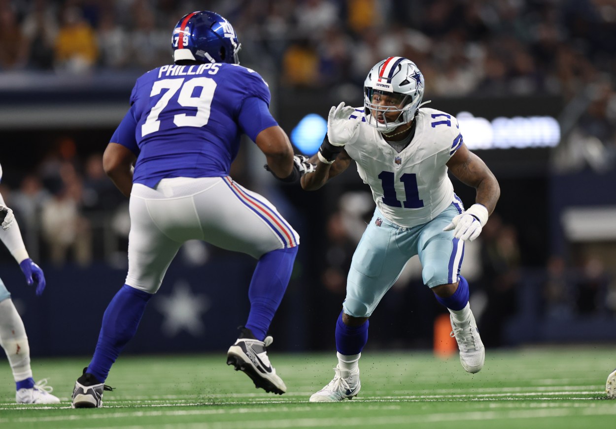 Dallas Cowboys linebacker Micah Parsons (11) rushes against New York Giants offensive tackle Tyre Phillips (79) during the game