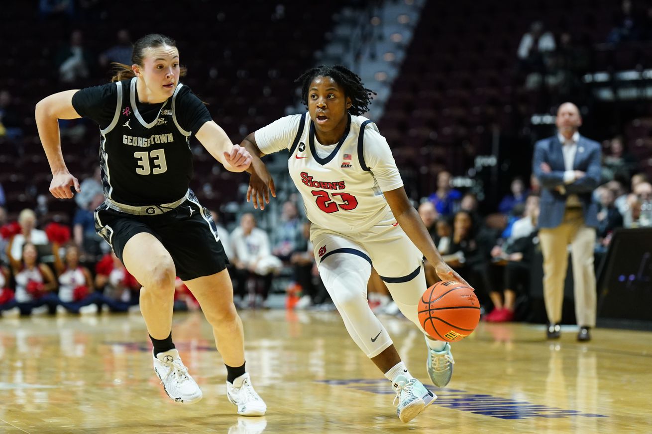 St. John’s Red Storm guard Ber’Nyah Mayo (23) drives the ball against Georgetown Hoyas forward Graceann Bennett (33) in the first half of the 2024 Big East women’s basketball tournament quarterfinal game at Mohegan Sun Arena. Mandatory Credit: David Butler II