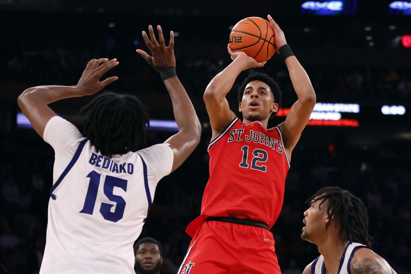 RJ Luis Jr. #12 of the St. John’s Red Storm shoots the ball as Jaden Bediako #15 and Dre Davis #14 of the Seton Hall Pirates defend in the first half during the Quarterfinals of the Big East Basketball Tournament at Madison Square Garden on March 14, 2024 in New York City.