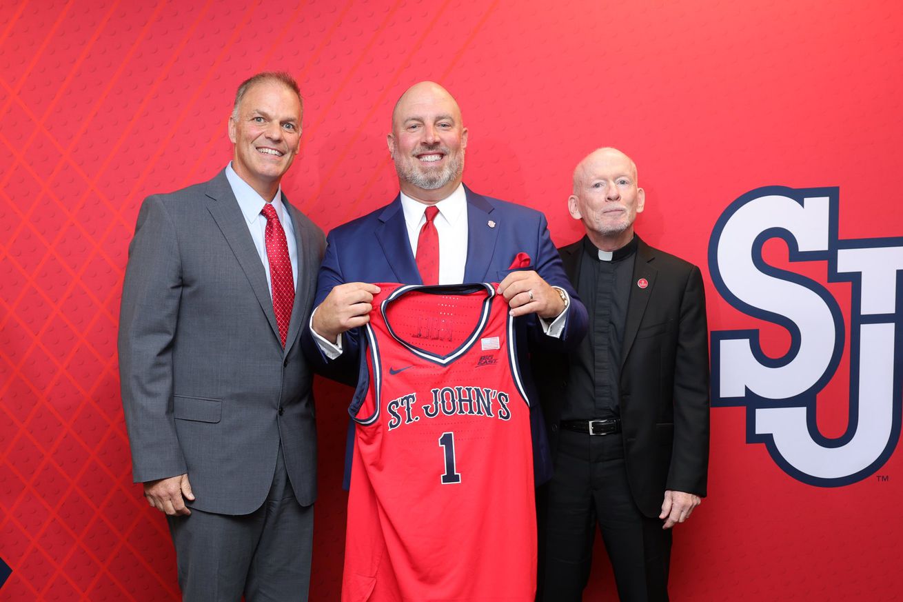 From left to right, St. John’s University chief operating officer Joe Oliva, newest St. John’s athletic director Ed Kull, and St. John’s University president Rev. Brian J. Shanley pose for a picture during Ed Kull’s introductory press conference inside the Janetschek Athletic Center on the campus of St. John’s University in Jamaica, New York