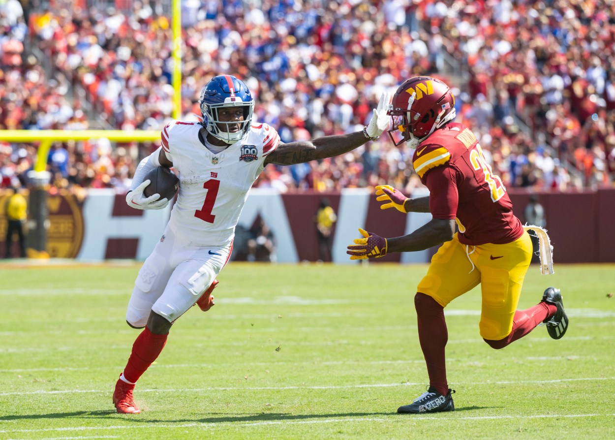 Sep 15, 2024; Landover, Maryland, USA; New York Giants wide receiver Malik Nabers (1) runs down the field pressured by Washington Comanders defensive back Juan Martin (20) in the first half at Commanders Field. Mandatory Credit: Luke Johnson-Imagn Images