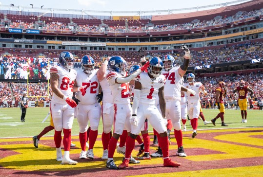 Sep 15, 2024; Landover, Maryland, USA; New York Giants wide receiver Malik Nabers (1) celebrates with teammates after catching a touchdown pass in the first half against the Washington Commanders at Commanders Field. Mandatory Credit: Luke Johnson-Imagn Images