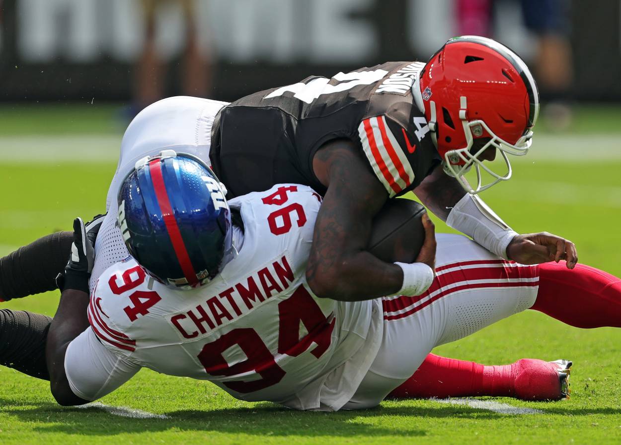 Cleveland Browns quarterback Deshaun Watson (4) is sacked by /New York Giants defensive tackle Elijah Chatman (94) during the first half of an NFL football game at Huntington Bank Field, Sunday, Sept. 22, 2024, in Cleveland, Ohio.