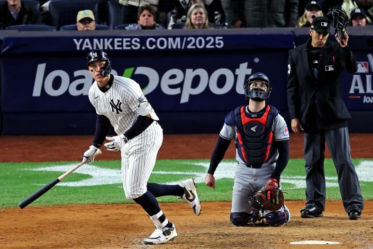 Oct 15, 2024; Bronx, New York, USA; New York Yankees outfielder Aaron Judge (99) hits a two run home run during the seventh inning against the Cleveland Guardians in game two of the ALCS for the 2024 MLB Playoffs at Yankee Stadium. Mandatory Credit: Brad Penner-Imagn Images