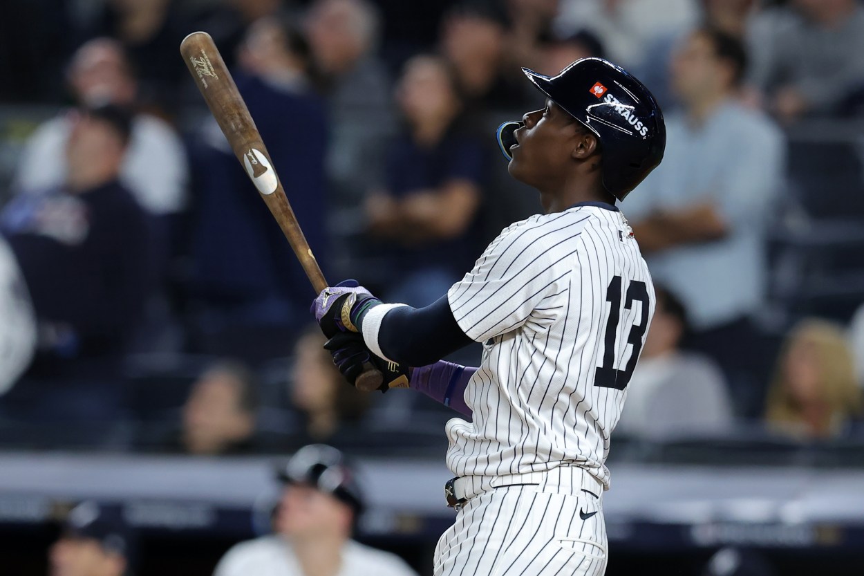 Oct 7, 2024; Bronx, New York, USA; New York Yankees third base Jazz Chisholm Jr. (13) hits a solo home run against the Kansas City Royals in the ninth inning during game two of the ALDS for the 2024 MLB Playoffs at Yankee Stadium. Mandatory Credit: Brad Penner-Imagn Images