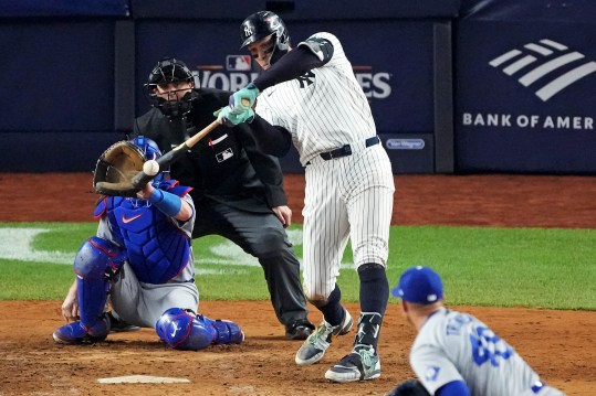 Oct 30, 2024; New York, New York, USA; New York Yankees outfielder Aaron Judge (99) hits a double during the eighth inning against the Los Angeles Dodgers in game four of the 2024 MLB World Series at Yankee Stadium. Mandatory Credit: Robert Deutsch-Imagn Images