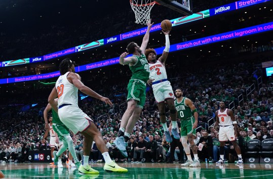 Oct 22, 2024; Boston, Massachusetts, USA; New York Knicks guard Miles McBride (2) shoots against Boston Celtics center Luke Kornet (40) in the second half at TD Garden. Mandatory Credit: David Butler II-Imagn Images