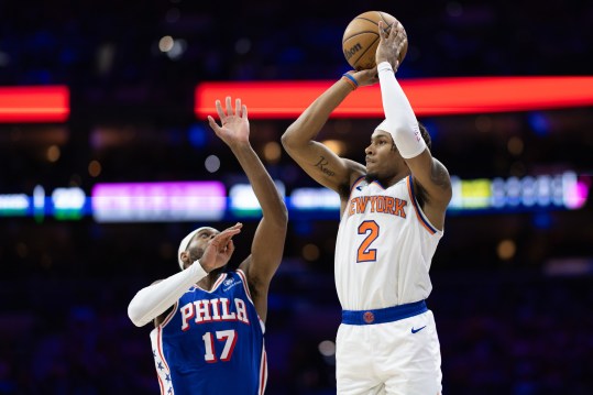 May 2, 2024; Philadelphia, Pennsylvania, USA; New York Knicks guard Miles McBride (2) shoots against Philadelphia 76ers guard Buddy Hield (17) during the first half of game six of the first round for the 2024 NBA playoffs at Wells Fargo Center. Mandatory Credit: Bill Streicher-Imagn Images