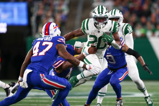 Oct 14, 2024; East Rutherford, New Jersey, USA; New York Jets running back Breece Hall (20) runs with the ball against the Buffalo Bills during the first half at MetLife Stadium. Mandatory Credit: Ed Mulholland-Imagn Images