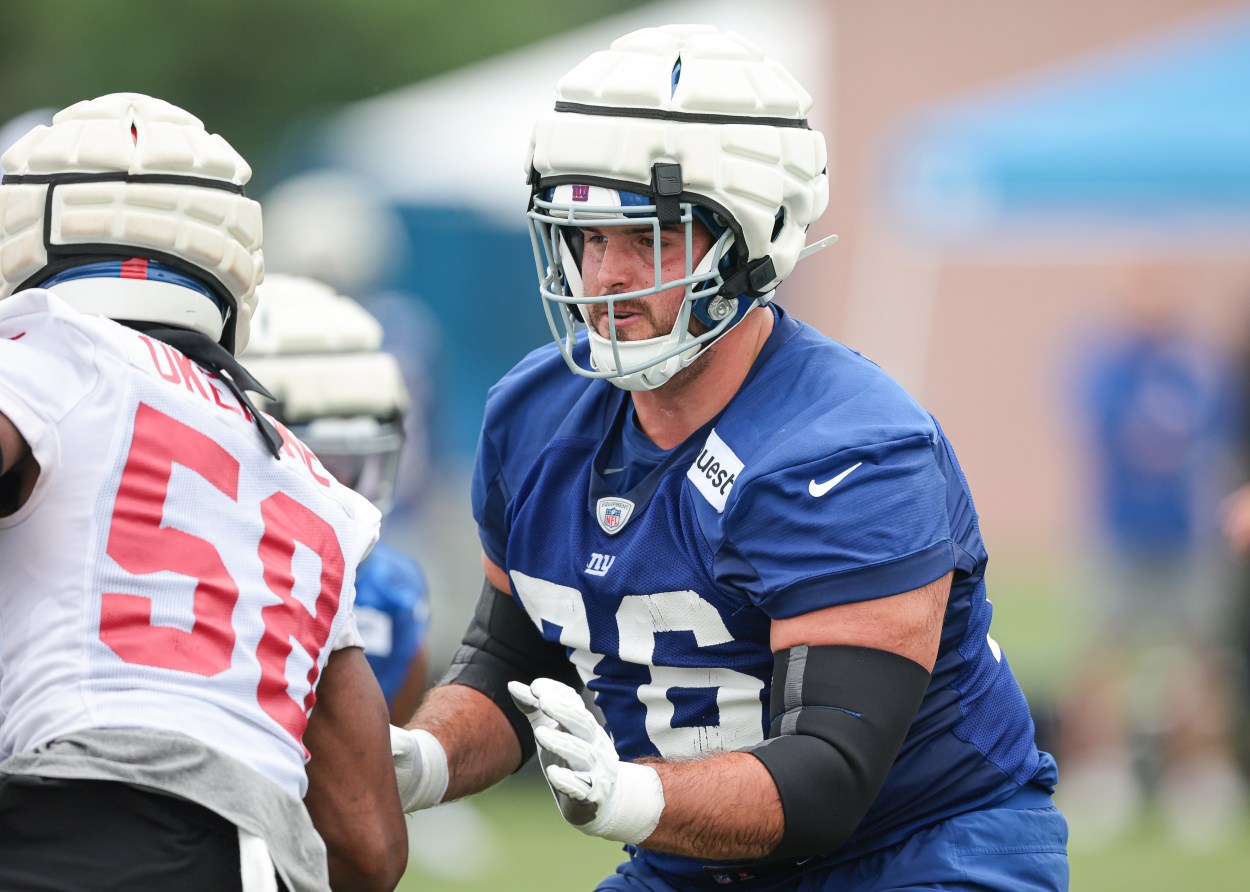 Jul 24, 2024; East Rutherford, NJ, USA; New York Giants guard Jon Runyan (76) blocks linebacker Bobby Okereke (58) during training camp at Quest Diagnostics Training Facility. Mandatory Credit: Vincent Carchietta-Imagn Images