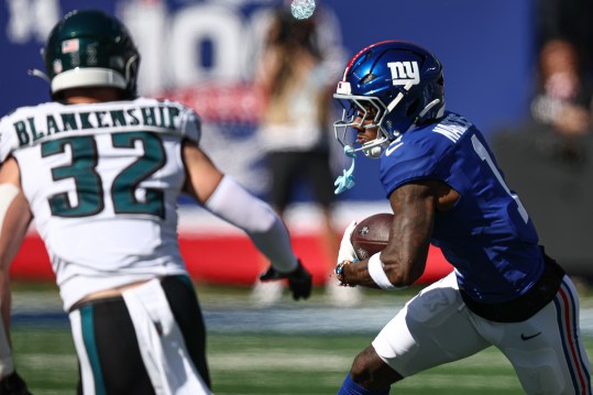 Oct 20, 2024; East Rutherford, New Jersey, USA; New York Giants wide receiver Malik Nabers (1) gains yards after catch as Philadelphia Eagles safety Reed Blankenship (32) pursues during the first half at MetLife Stadium. Mandatory Credit: Vincent Carchietta-Imagn Images