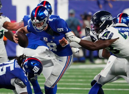 Oct 2, 2023; East Rutherford, New Jersey, USA; Seattle Seahawks linebacker Boye Mafe (53) sacks New York Giants quarterback Daniel Jones (8) in the 4th quarter at MetLife Stadium. Mandatory Credit: Robert Deutsch-Imagn Images