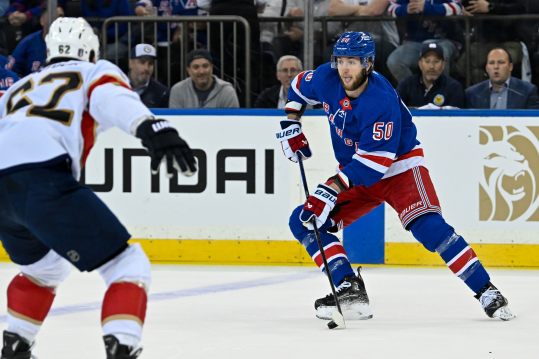 May 30, 2024; New York, New York, USA; New York Rangers left wing Will Cuylle (50) controls the puck against the Florida Panthers during the first period in game five of the Eastern Conference Final of the 2024 Stanley Cup Playoffs at Madison Square Garden. Mandatory Credit: Dennis Schneidler-USA TODAY Sports