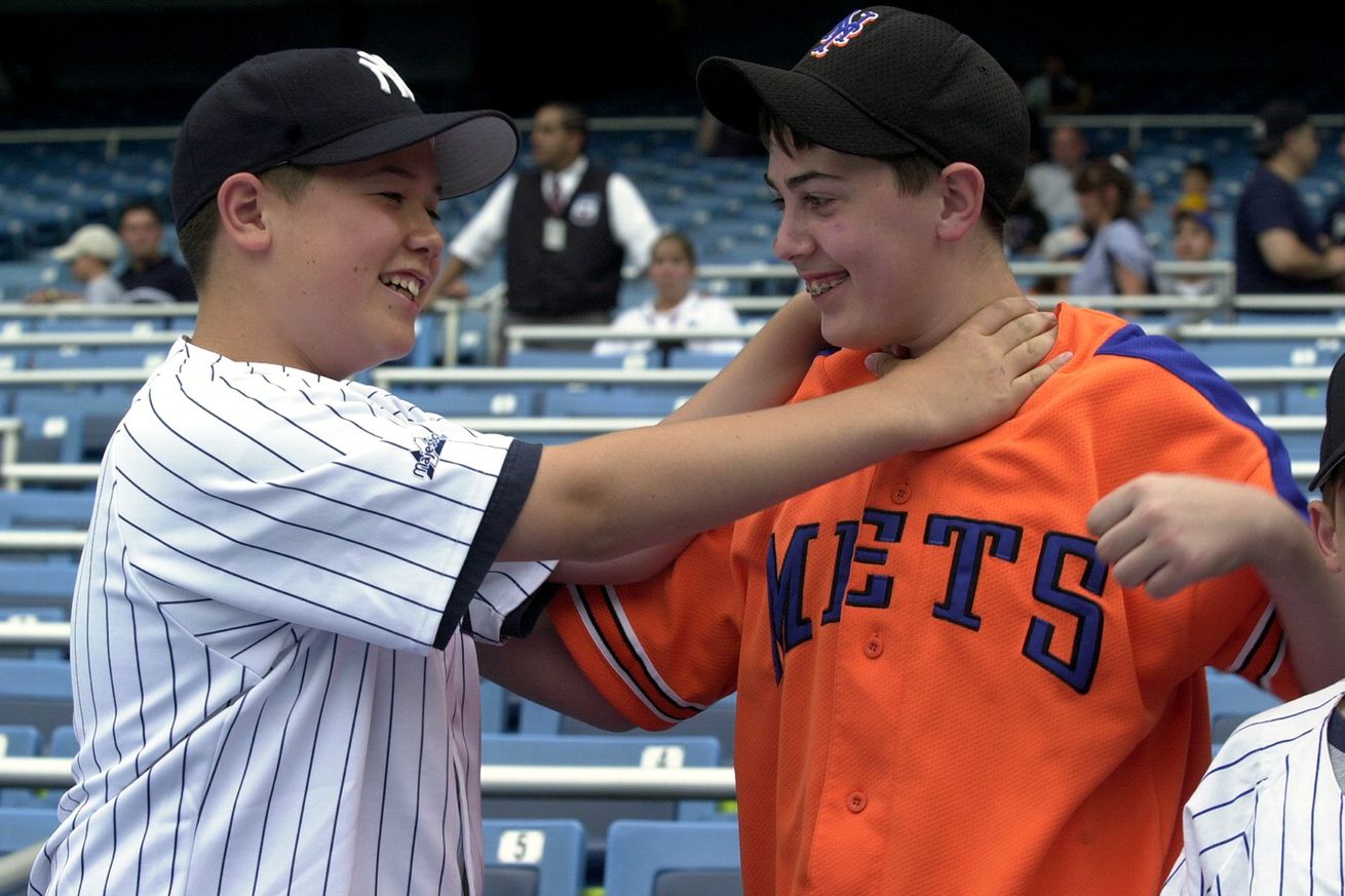 Yankees fan Jarred Hassel and Mets fan Danny Ahearn goof aro