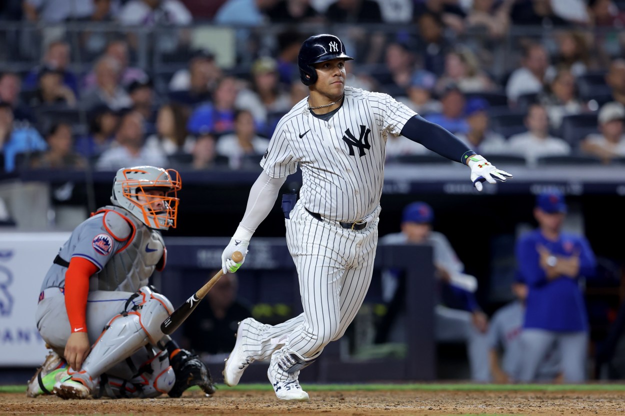 Jul 24, 2024; Bronx, New York, USA; New York Yankees right fielder Juan Soto (22) follows through on a double against the New York Mets during the seventh inning at Yankee Stadium. Mandatory Credit: Brad Penner-Imagn Images