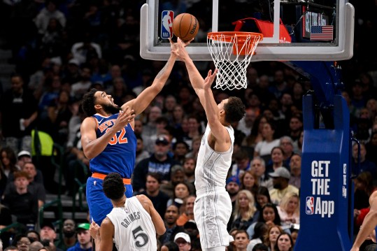 Nov 27, 2024; Dallas, Texas, USA; New York Knicks center Karl-Anthony Towns (32) and Dallas Mavericks center Dwight Powell (7) battle for the rebound during the second quarter at the American Airlines Center. Mandatory Credit: Jerome Miron-Imagn Images