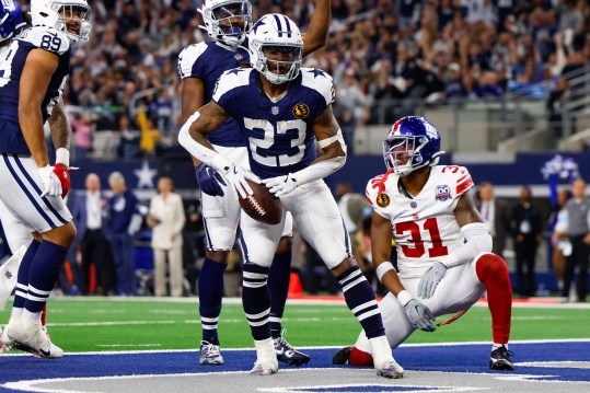 Nov 28, 2024; Arlington, Texas, USA; Dallas Cowboys running back Rico Dowdle (23) rushes for a touchdown during the third quarter against the New York Giants at AT&T Stadium. Mandatory Credit: Andrew Dieb-Imagn Images