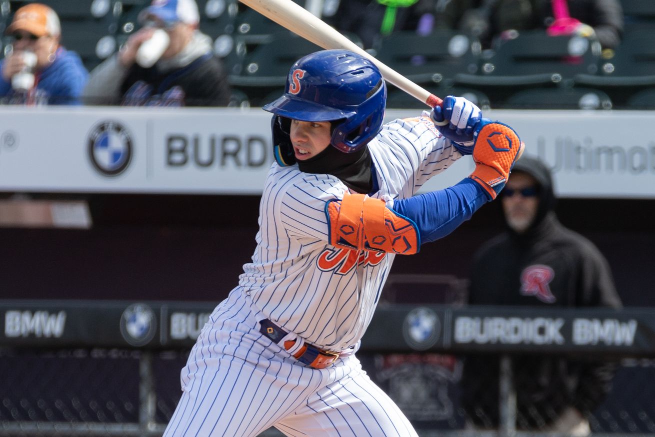 Drew Gilbert bats in a home Syracuse Mets uniform