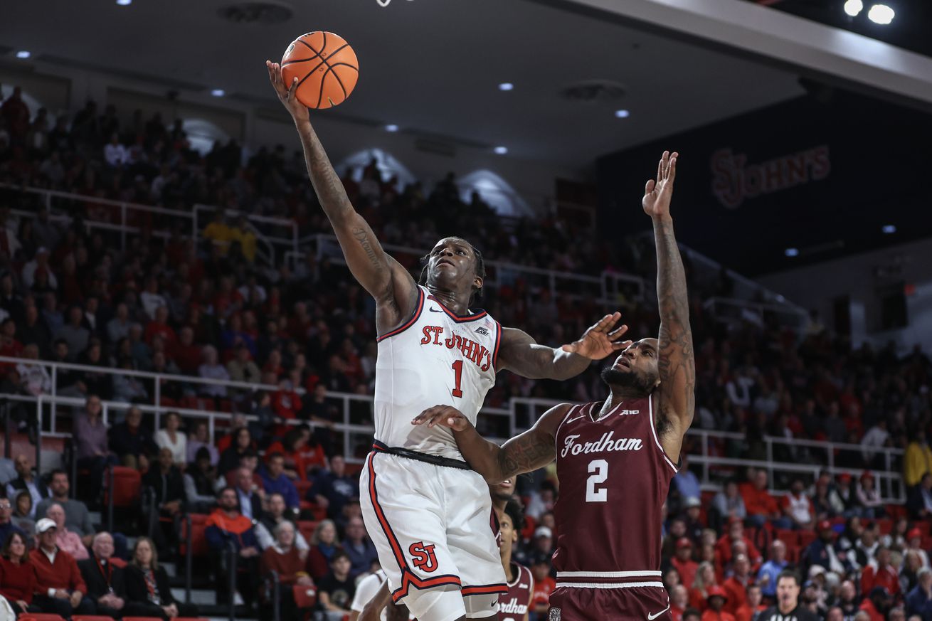 Nov 4, 2024; Queens, New York, USA; St. John’s Red Storm guard Kadary Richmond (1) drives past Fordham Rams forward Romad Dean (2) in the second half at Carnesecca Arena. Mandatory Credit: Wendell Cruz-Imagn Images