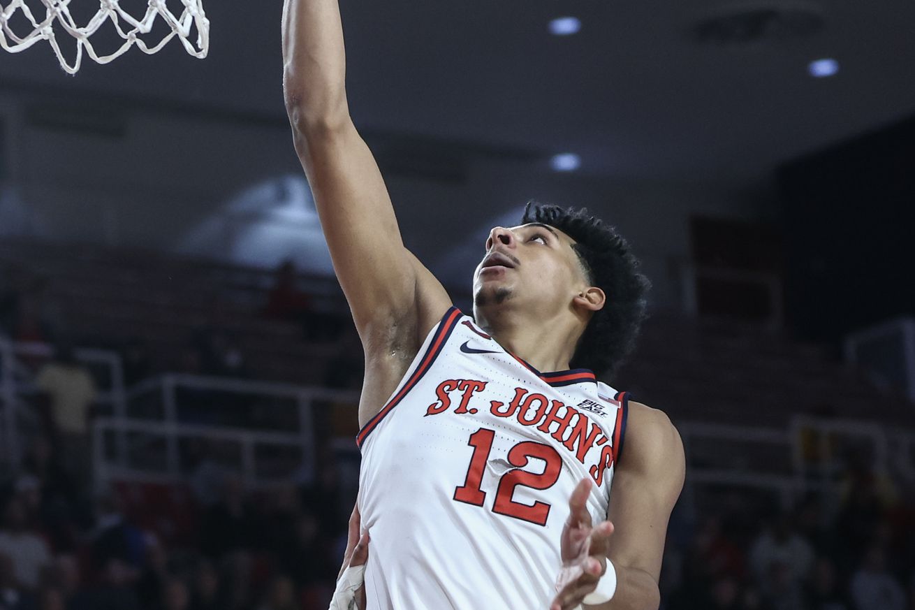 Nov 13, 2024; Queens, New York, USA; St. John’s Red Storm guard RJ Luis Jr. (12) drives to the basket for a layup in the second half against the Wagner Seahawks at Carnesecca Arena. Mandatory Credit: Wendell Cruz-Imagn Images