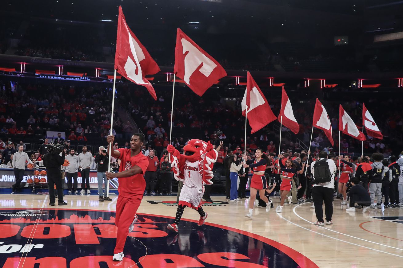 Nov 17, 2024; New York, New York, USA; The St. John’s Red Storm cheer squad runs out for the starting introductions prior to the game against the New Mexico Lobos at Madison Square Garden. Mandatory Credit: Wendell Cruz-Imagn Images