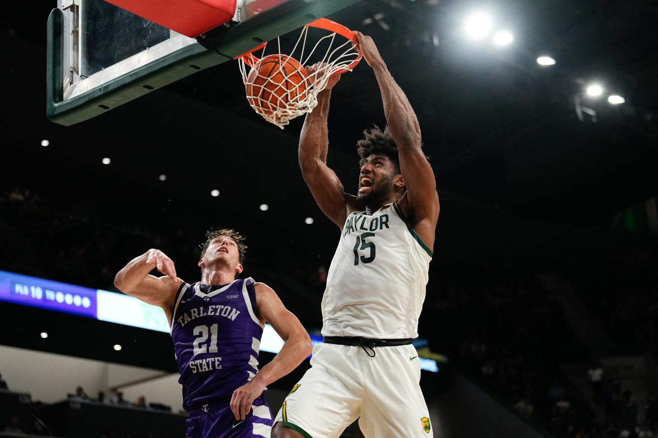 Nov 17, 2024; Waco, Texas, USA; Baylor Bears forward Norchad Omier (15) dunks the ball against Tarleton Texans guard Nick Krass (21) during the first half at Paul and Alejandra Foster Pavilion. Mandatory Credit: Chris Jones-Imagn Images