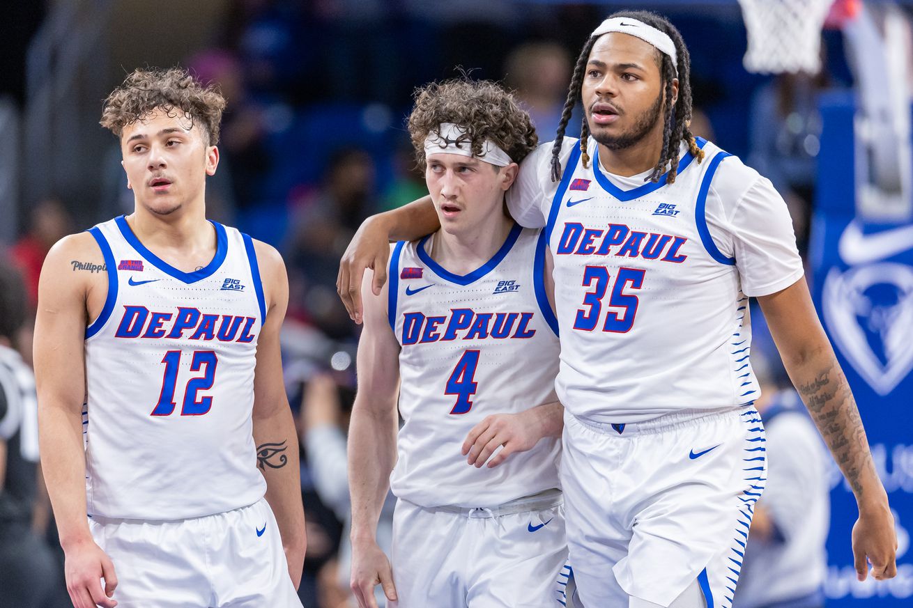 CHICAGO, ILLINOIS - DECEMBER 10: Jacob Meyer #12, Conor Enright #4 and NJ Benson #35 of the DePaul Blue Demons are seen during the game against the Providence Friars at Wintrust Arena on December 10, 2024 in Chicago, Illinois.