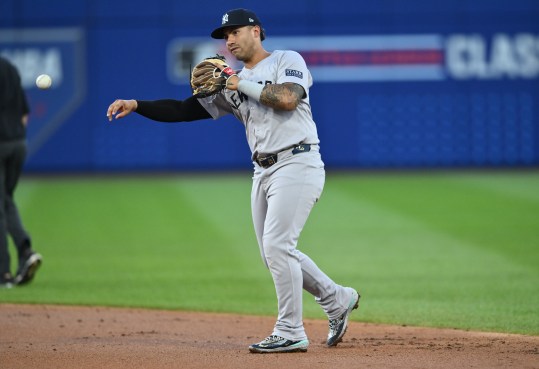 Aug 18, 2024; Williamsport, Pennsylvania, USA; New York Yankees infielder Gleyber Torres (25) throws to first against the Detroit Tigers in the second inning at BB&T Ballpark at Historic Bowman Field. Mandatory Credit: Kyle Ross-Imagn Images