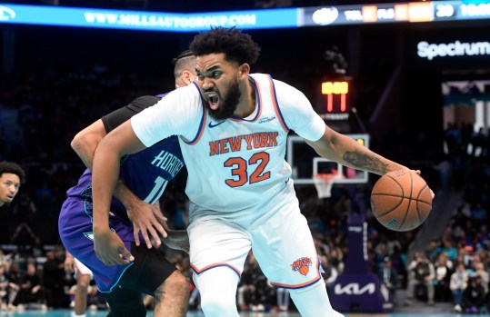 Nov 29, 2024; Charlotte, North Carolina, USA;  New York Knicks center Karl-Anthony Towns (32) drives in during the first half against the Charlotte Hornets at the Spectrum Center. Mandatory Credit: Sam Sharpe-Imagn Images