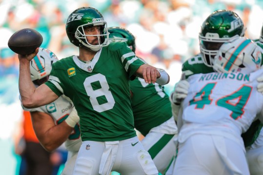 Dec 8, 2024; Miami Gardens, Florida, USA; New York Jets quarterback Aaron Rodgers (8) throws the football against the Miami Dolphins during the second quarter at Hard Rock Stadium. Mandatory Credit: Sam Navarro-Imagn Images