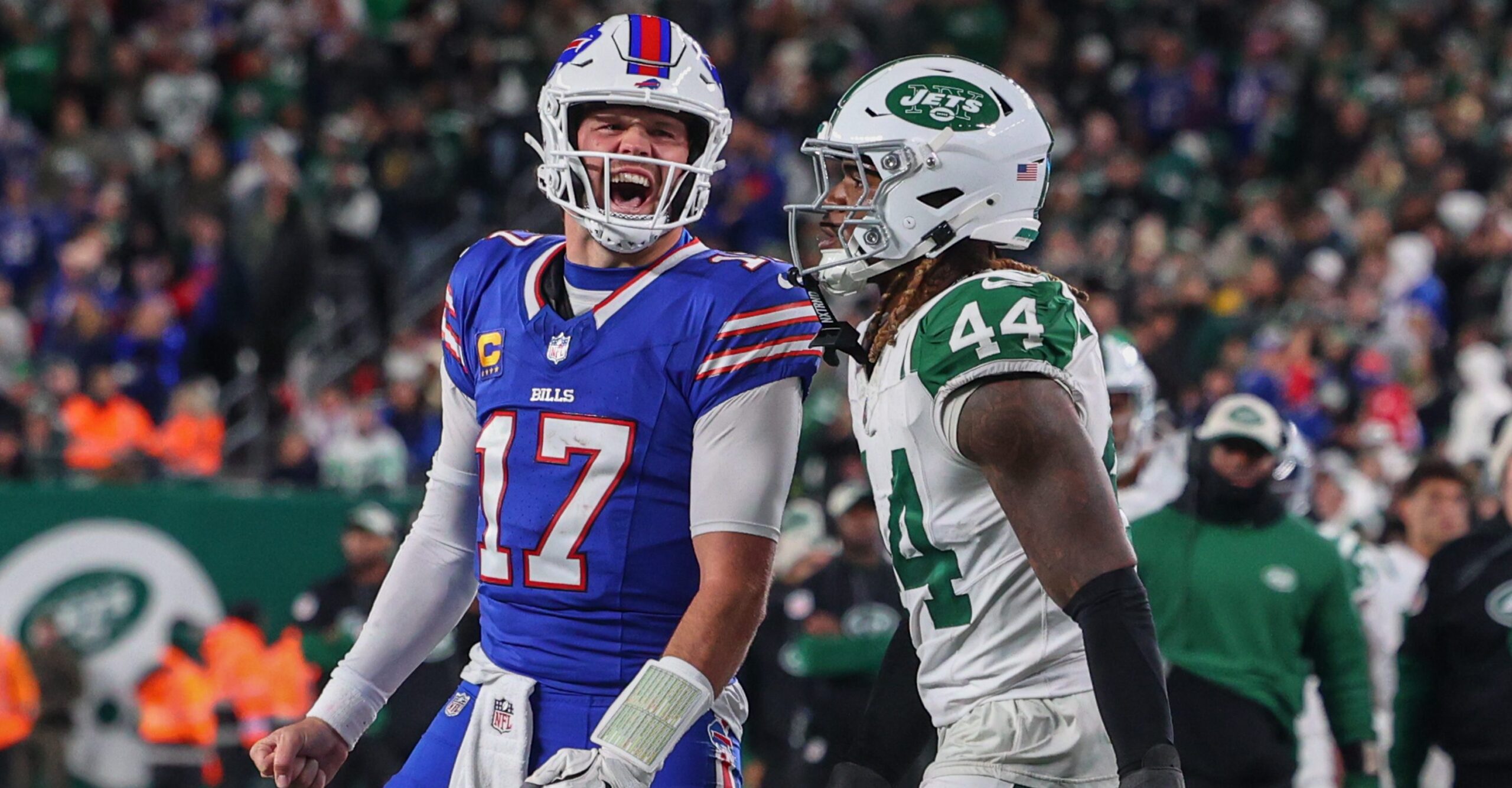 Buffalo Bills quarterback Josh Allen (17) yells at New York Jets linebacker Jamien Sherwood (44) after throwing a touchdown during an NFL game at MetLife Stadium in East Rutherford, New Jersey.