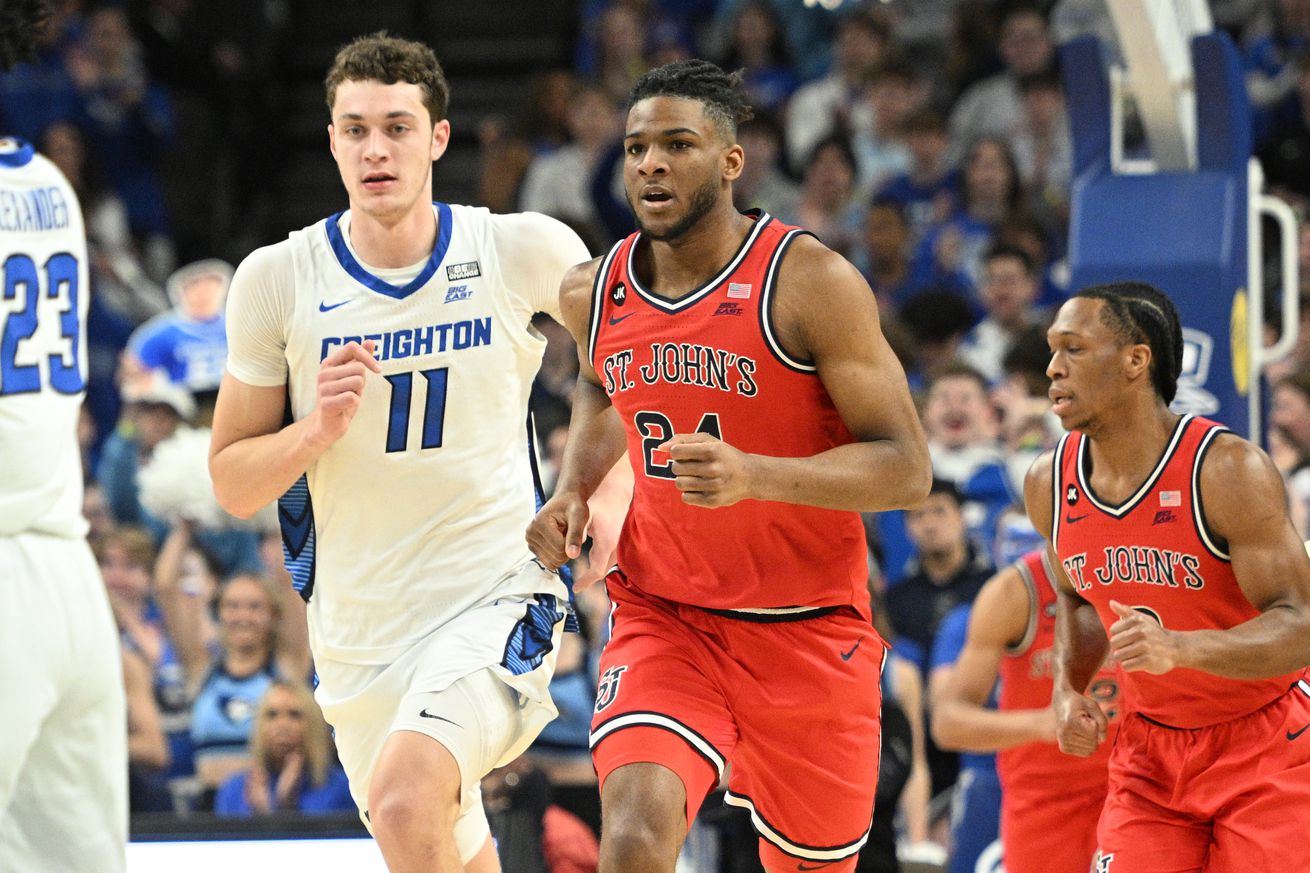 Jan 13, 2024; Omaha, Nebraska, USA; St. John’s Red Storm forward Zuby Ejiofor (24) and Creighton Bluejays center Ryan Kalkbrenner (11) run the court in the first half at CHI Health Center Omaha. Mandatory Credit: Steven Branscombe-Imagn Images