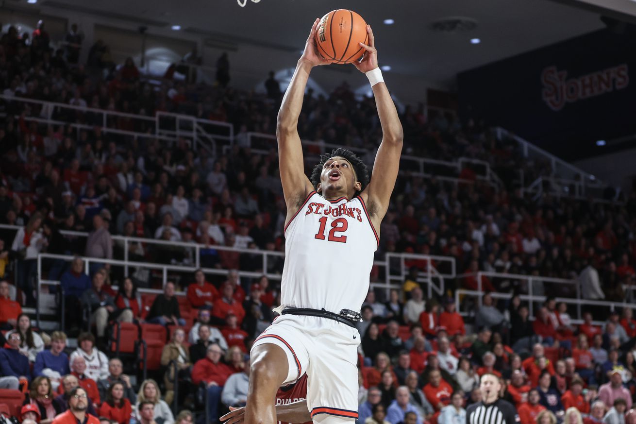 Nov 30, 2024; Queens, New York, USA; St. John’s Red Storm guard RJ Luis Jr. (12) goes up for a dunk in the second half against the Harvard Crimson at Carnesecca Arena. Mandatory Credit: Wendell Cruz-Imagn Images