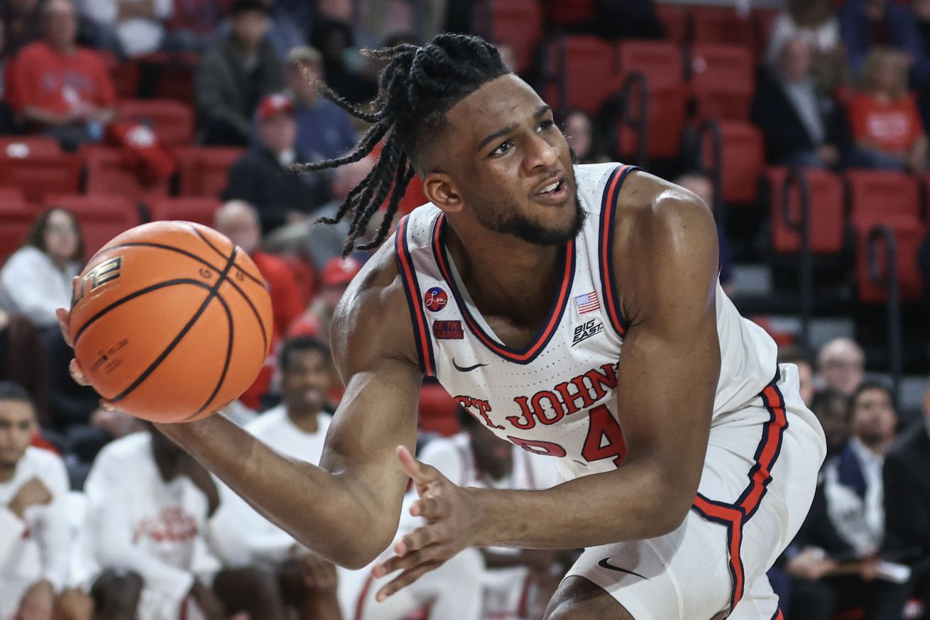 Dec 11, 2024; Queens, New York, USA; St. John’s Red Storm forward Zuby Ejiofor (24) grabs a loose ball in the second half against the Bryant University Bulldogs at Carnesecca Arena. Mandatory Credit: Wendell Cruz-Imagn Images