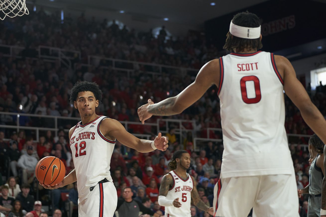 R.J. Luis (#12) reaches out to high-five Aaron Scott (#0) during the St. John’s Red Storm vs. Butler Bulldogs men’s basketball game at Carnesecca Arena in Jamaica, New York on Saturday, January 4, 2025. Photo credit to Chris Hagan