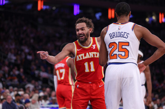 Jan 20, 2025; New York, New York, USA; Atlanta Hawks guard Trae Young (11) reacts in front of New York Knicks forward Mikal Bridges (25) during the first half at Madison Square Garden. Mandatory Credit: Vincent Carchietta-Imagn Images