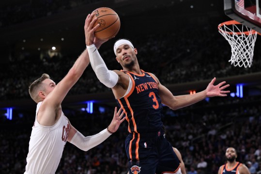 Oct 28, 2024; New York, New York, USA; New York Knicks guard Josh Hart (3) grabs a rebound against Cleveland Cavaliers guard Sam Merrill (5) during the second half at Madison Square Garden. Mandatory Credit: John Jones-Imagn Images