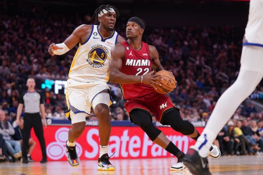 Oct 27, 2022; San Francisco, California, USA; Miami Heat forward Jimmy Butler (22) drives past Golden State Warriors forward Kevon Looney (5) in the fourth quarter at the Chase Center. Mandatory Credit: Cary Edmondson-Imagn Images