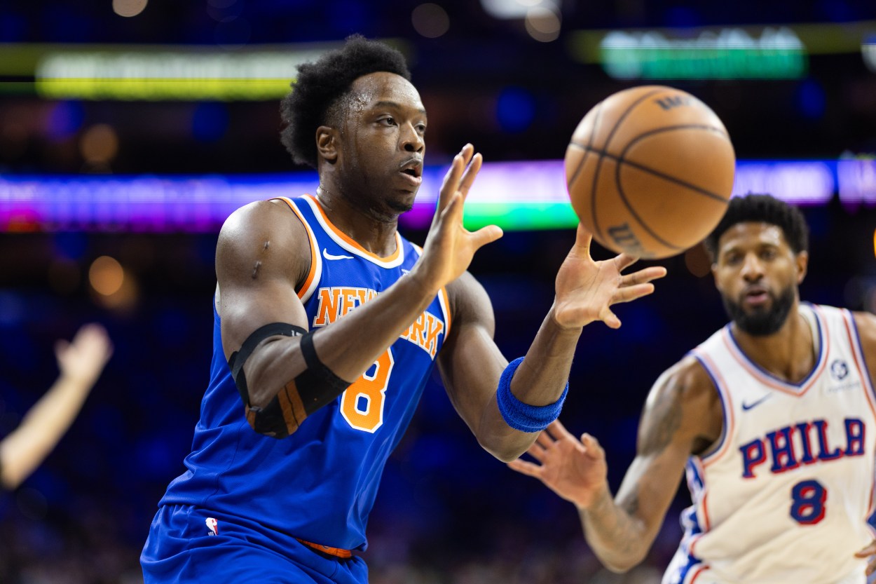 Jan 15, 2025; Philadelphia, Pennsylvania, USA; New York Knicks forward OG Anunoby (8) catches a pass in front of Philadelphia 76ers forward Paul George (8) during the first quarter at Wells Fargo Center. Mandatory Credit: Bill Streicher-Imagn Images