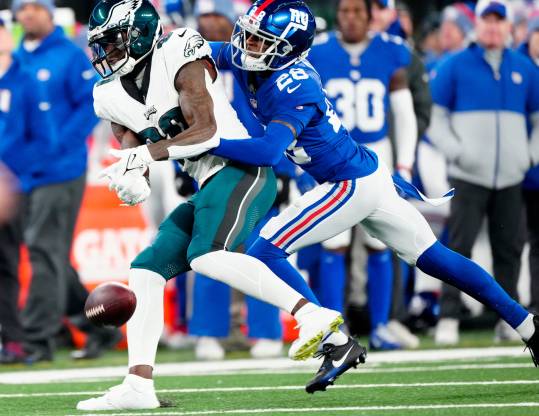 New York Giants cornerback Cor'Dale Flott (28) makes sure Philadelphia Eagles wide receiver Julio Jones (80) does not complete a second quarter pass, Sunday, January 7, 2024.