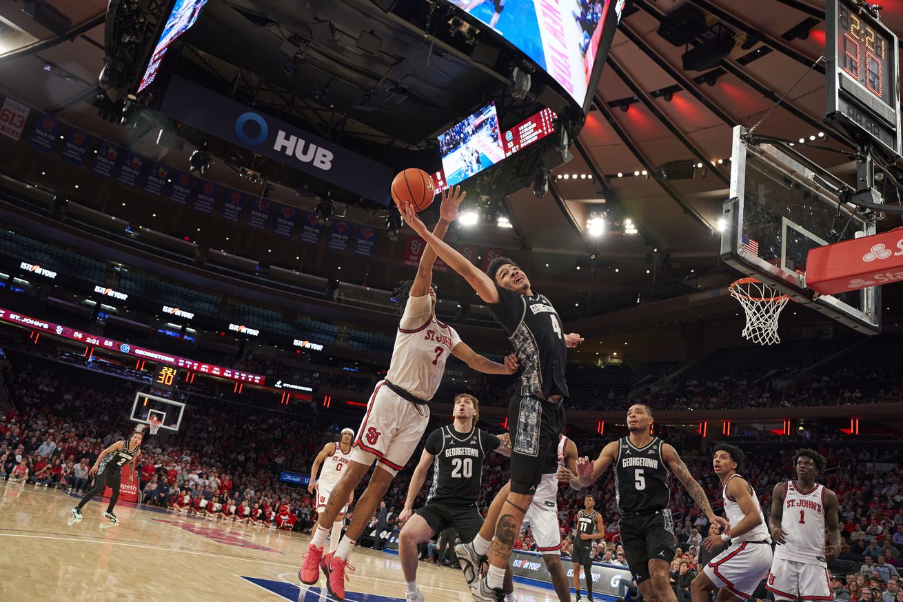 Simeon Wilcher (#7) blocks Caleb Williams (#7) in the St. John’s Red Storm vs. Georgetown Hoyas men’s basketball game at Madison Square Garden in New York, New York on Tuesday, January 14, 2025. Photo credit to Chris Hagan (cdhagan.com).