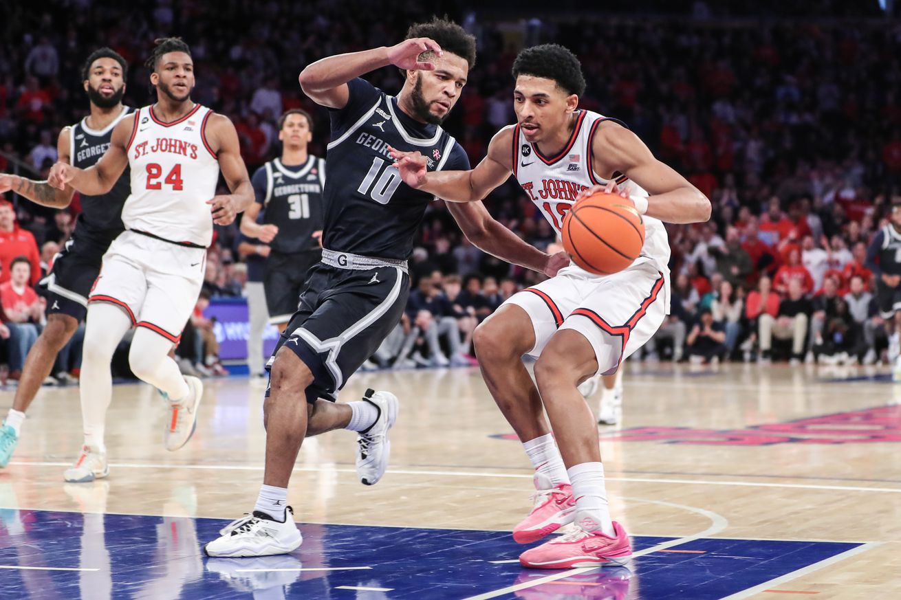 Mar 9, 2024; New York, New York, USA; St. John’s Red Storm guard RJ Luis Jr. (12) drives past Georgetown Hoyas guard Jayden Epps (10) in the second half at Madison Square Garden. Mandatory Credit: Wendell Cruz-Imagn Images