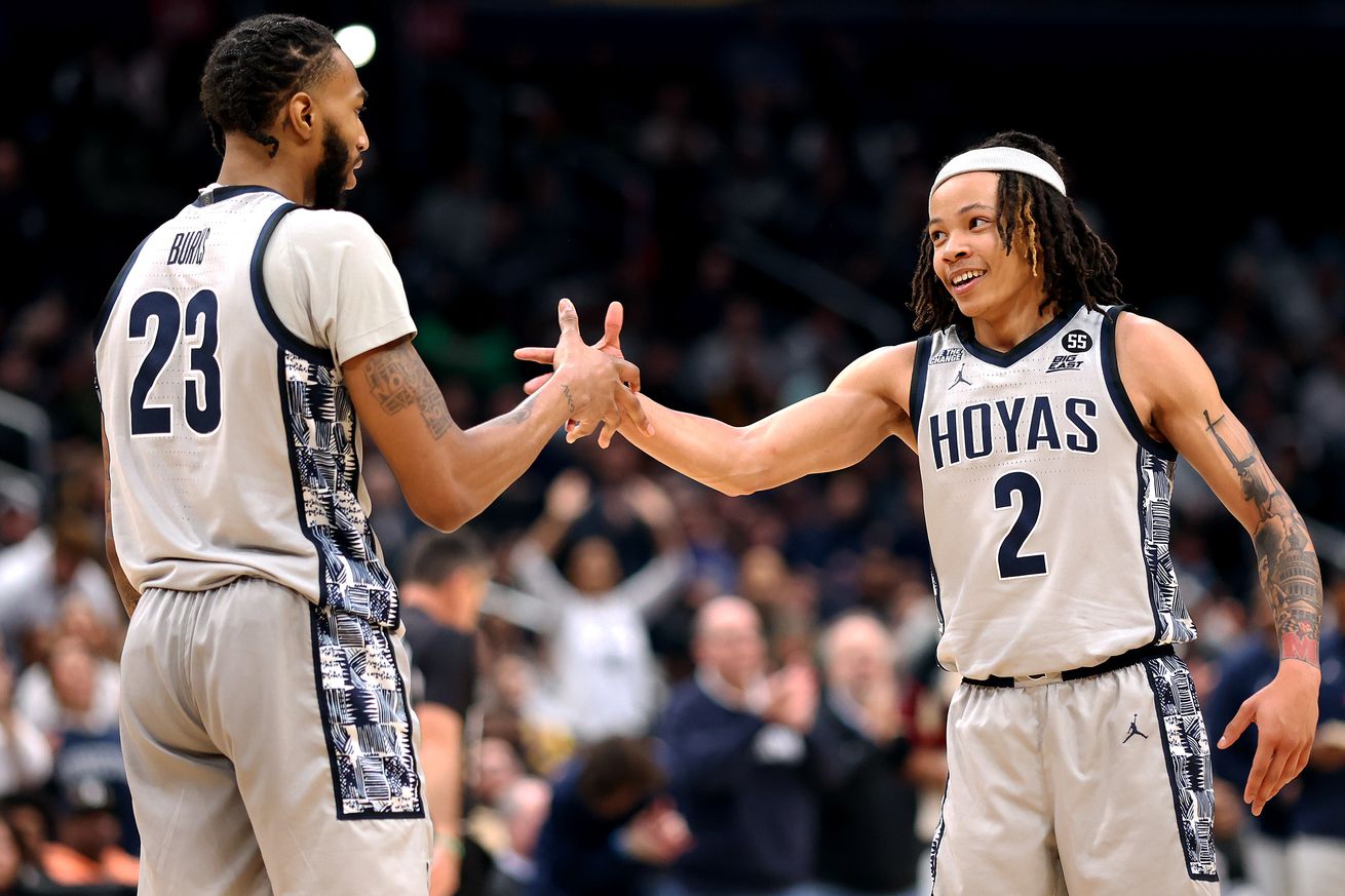 Jan 3, 2025; Washington, District of Columbia, USA; Georgetown Hoyas guard Malik Mack (2) interacts with forward Jordan Burks (23) during the second half against the Xavier Musketeers at Capital One Arena. Mandatory Credit: Daniel Kucin Jr.-Imagn Images