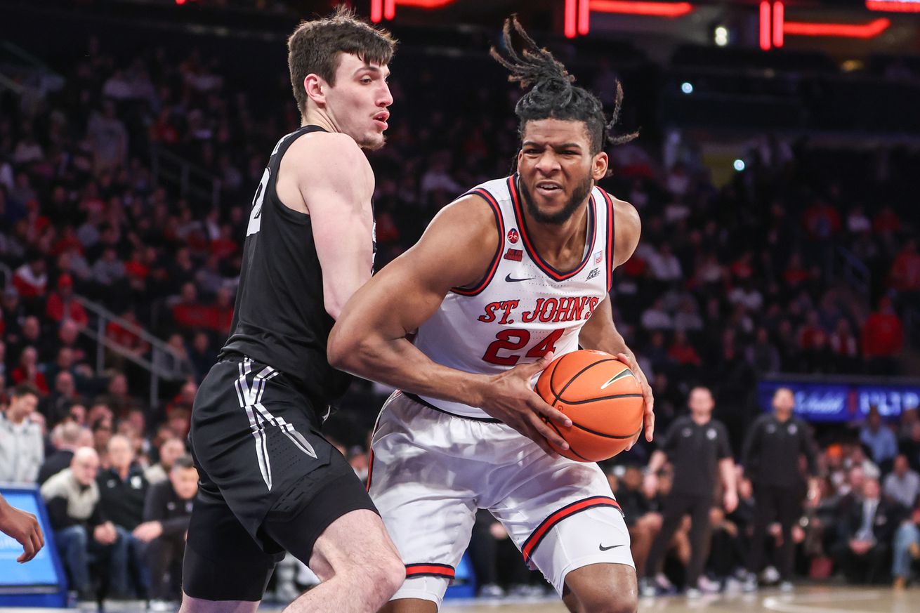 Jan 22, 2025; New York, New York, USA; St. John’s Red Storm forward Zuby Ejiofor (24) looks to post up against Xavier Musketeers forward Zach Freemantle (32) in the second half at Madison Square Garden. Mandatory Credit: Wendell Cruz-Imagn Images