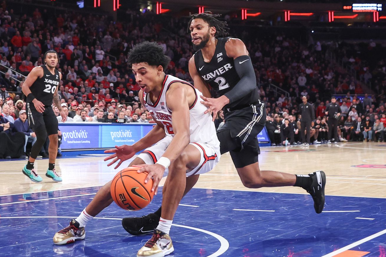 Jan 22, 2025; New York, New York, USA; St. John’s Red Storm guard RJ Luis Jr. (12) and Xavier Musketeers forward Jerome Hunter (2) chase after the ball in the second half at Madison Square Garden. Mandatory Credit: Wendell Cruz-Imagn Images