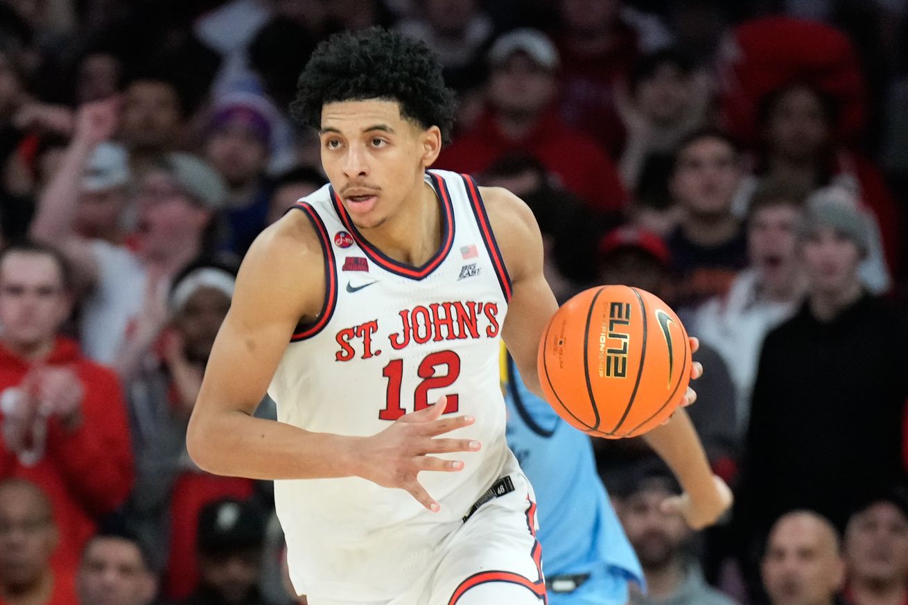 NEW YORK, NY - FEBRUARY 4: RJ Luis Jr. #12 of the St. John’s Red Storm dribbles the ball in the first half of a college basketball game against the Marquette Golden Eagles at Madison Square Garden on February 4, 2025 in New York City. (Photo by Porter Binks/Getty Images).