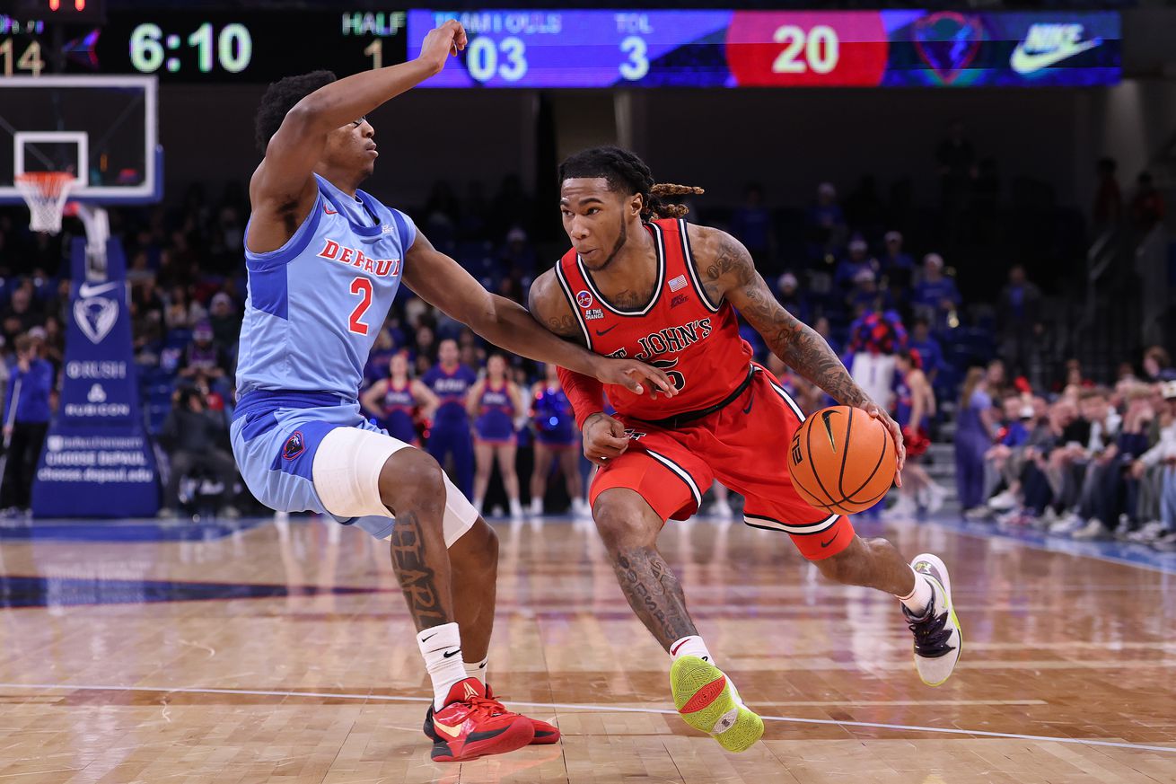 CHICAGO, ILLINOIS - FEBRUARY 19: Deivon Smith #5 of the St. John’s Red Storm drives to the basket against Layden Blocker #2 of the DePaul Blue Demons during the first half at Wintrust Arena on February 19, 2025 in Chicago, Illinois.