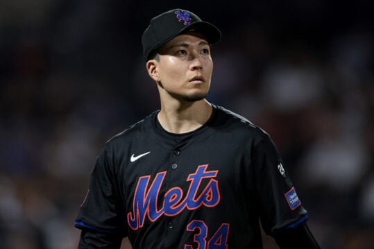 Jul 26, 2024; New York City, New York, USA; New York Mets starting pitcher Kodai Senga (34) looks back at the main scoreboard during the fourth inning against the Atlanta Braves at Citi Field. Mandatory Credit: Vincent Carchietta-USA TODAY Sports